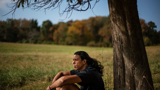 Annawon Weeden, 46, a member of the Mashpee Wampanoag Tribe, sits for a portrait outside his home in Oakdale, Conn., Friday, Sept. 25, 2020. "How do you pay somebody for that?" said Weeden when asked if governments should make financial reparations to Native people. "The most valuable thing anyone can have or possess ever is time and you don't get that time back. I don't get my ancestors back. It's degrading to think that you could buy your way out of what you put us in. Actions speak for themselves," Weeden said. "You don't got to pay me a dime. Clean up your community, show some respect. Pay the land the respect. It's never about me. It's about this land. I'm only here for a short time. This land had to last a lot longer. Your children are going to have to inherit this. What do you want to leave them? Let's look about our children and how our children's lives are going to turn out because if we can't get things to go better for them, we've all failed."
