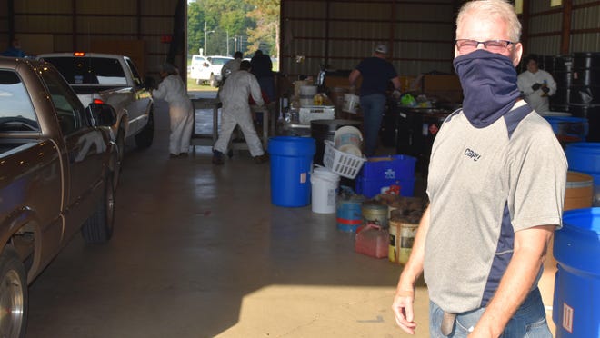 CBPU Waste Reduction Manager Bob Granger superives as crews take hazardous waste for safe disposal during the annual collection in Coldwater.