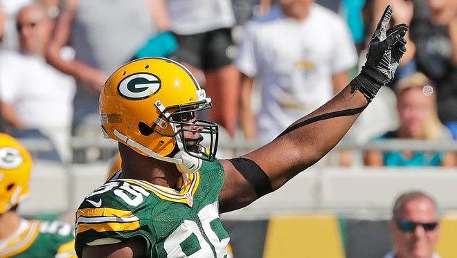 Green Bay Packers defensive end Datone Jones (95) celebrates the fourth down stop that clinched the game against the Jacksonville Jaguars at Everbank Field.