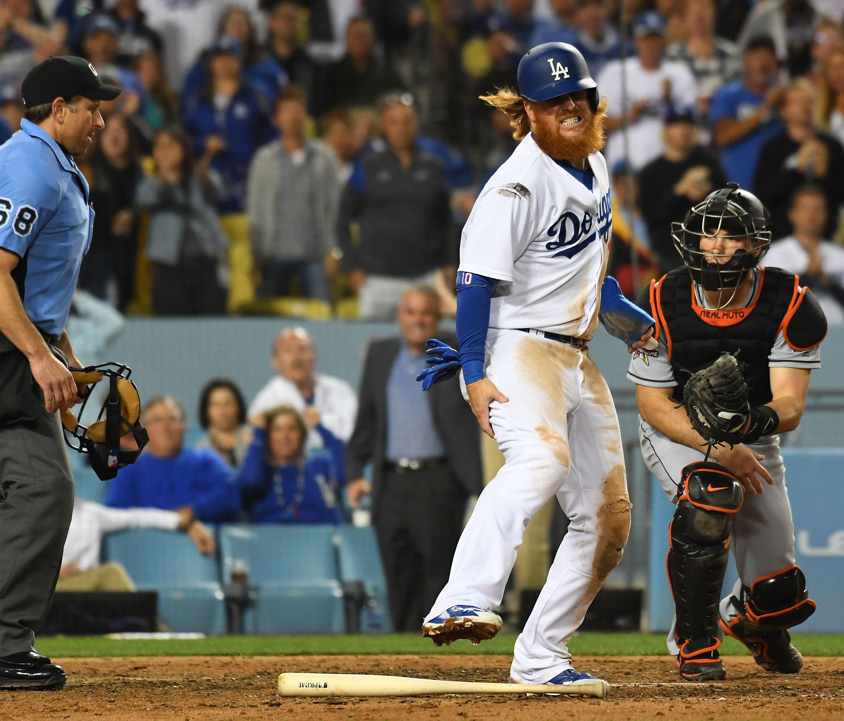 Justin Turner reacts after sufferering a right hamstring injury against the Miami Marlins.