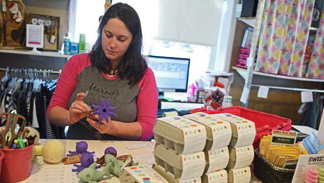 Liz Wittrock, an employee at Elegant Mommy who is pregnant and having a home birth, labels items Thursday, March 2, 2017, at Elegant Mommy in Sioux Falls. Wittrock hopes the passage of Senate Bill 136 will allow more women to choose home birth, as she has for her fourth child.  