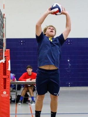 Kettle Moraine's Aaron Smet (5) sets during the Kettle Moraine boys varsity volleyball tournament on Saturday, Sept. 2, 2017.
