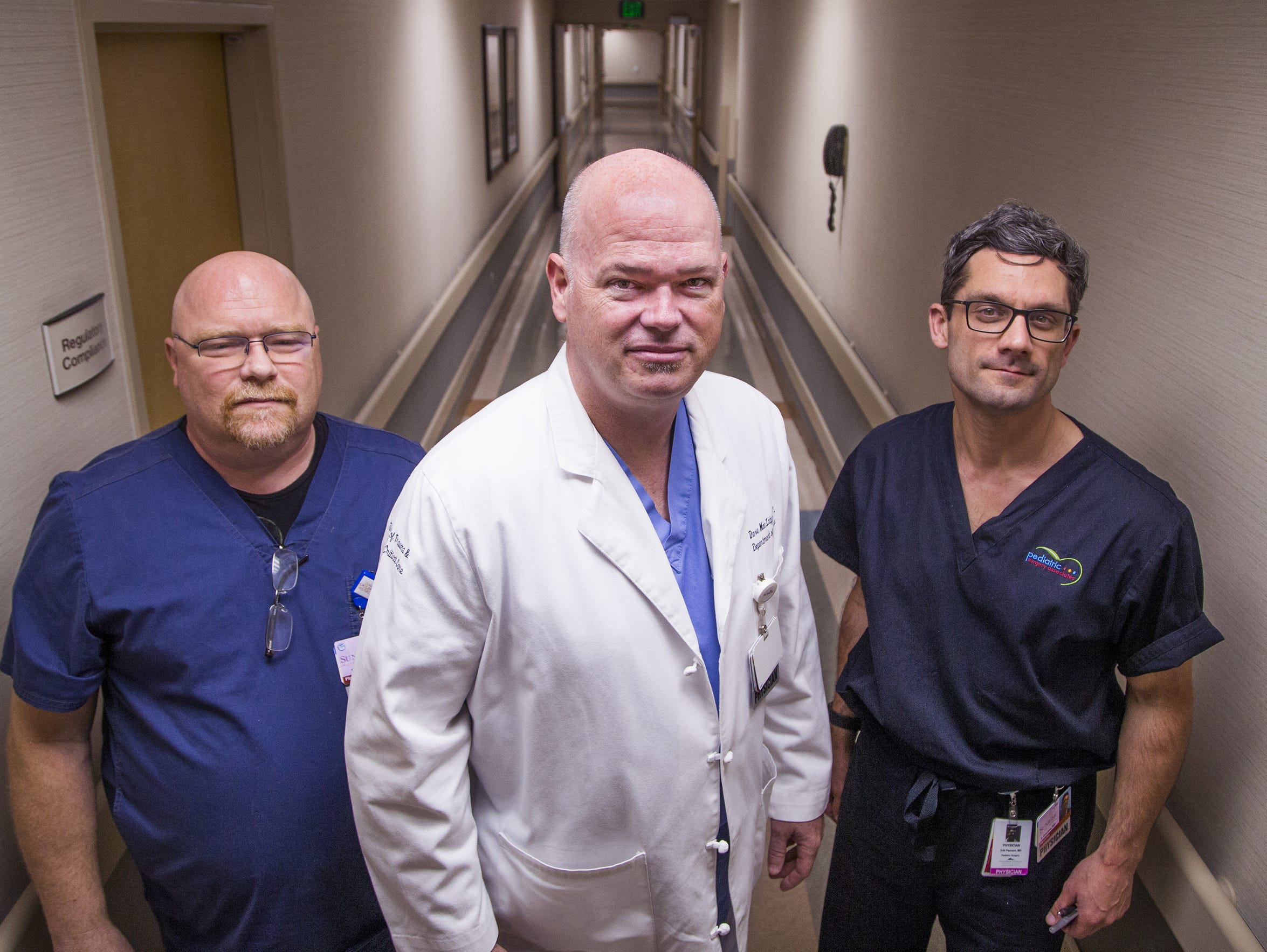 Trauma surgeon Dr. Dave MacIntyre (middle) and pediatric physicians Drs. Jim Andrus (left) and Erik Pearson.