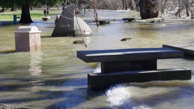 The Sacramento River floods a portion of Caldwell Park in Redding on Thursday.