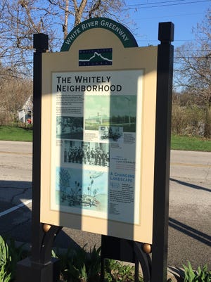 The Whitely Neighborhood sign along White River in Muncie.