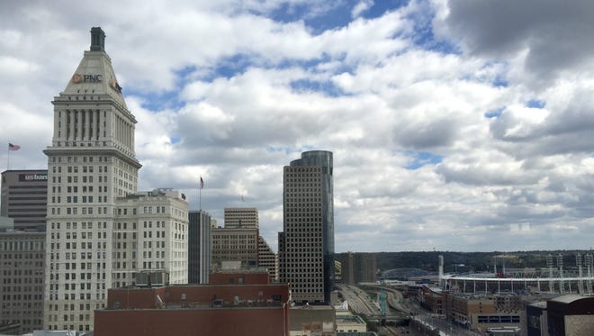 Clouds and rain move across the Cincinnati skyline.