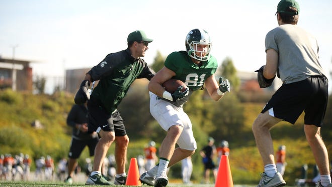 Michigan State players work out at Mesa College on Sunday ahead of the Holiday Bowl.