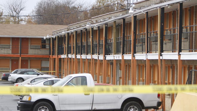 Springfield police investigate a shooting at Economy Inn on Glenstone Avenue in north Springfield on Nov. 15, 2014.