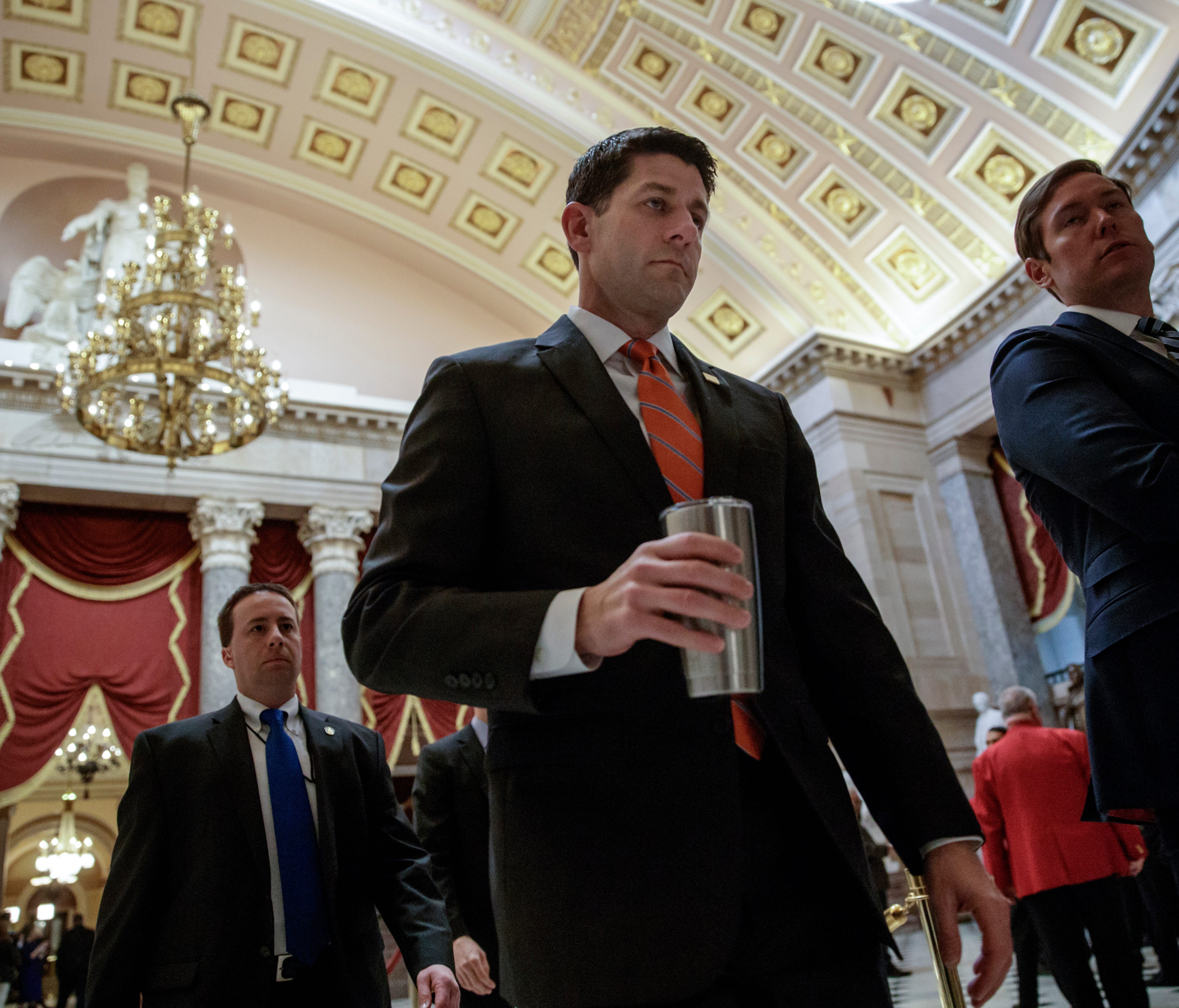 House Speaker Paul Ryan walks to his office on Capitol Hill on March 23, 2017, as he and the Republican leadership scramble for votes on their health care overhaul in the face of opposition from reluctant conservatives in the House Freedom Caucus.