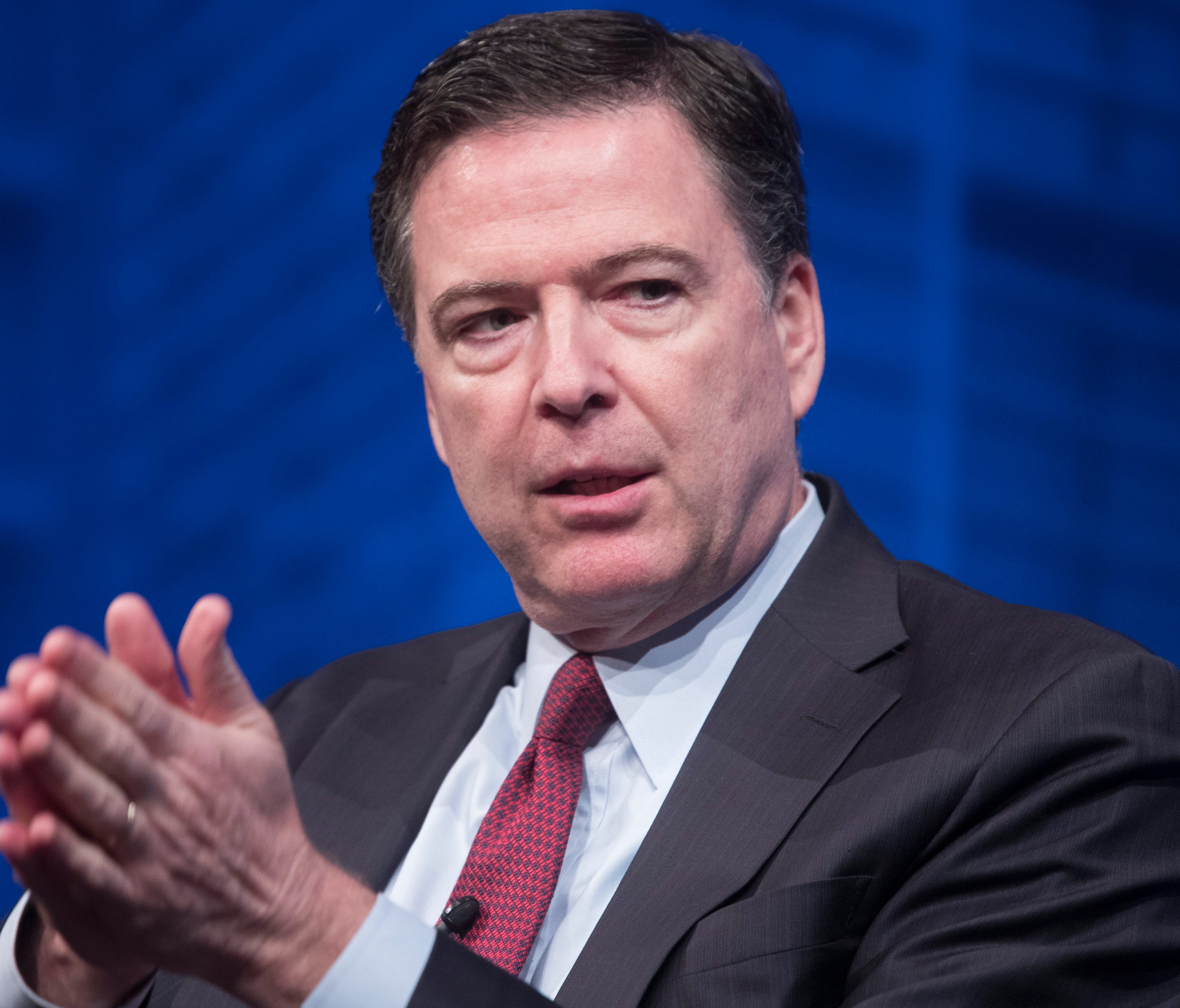 FBI Director James Comey is pictured speaking at the TV screening of 