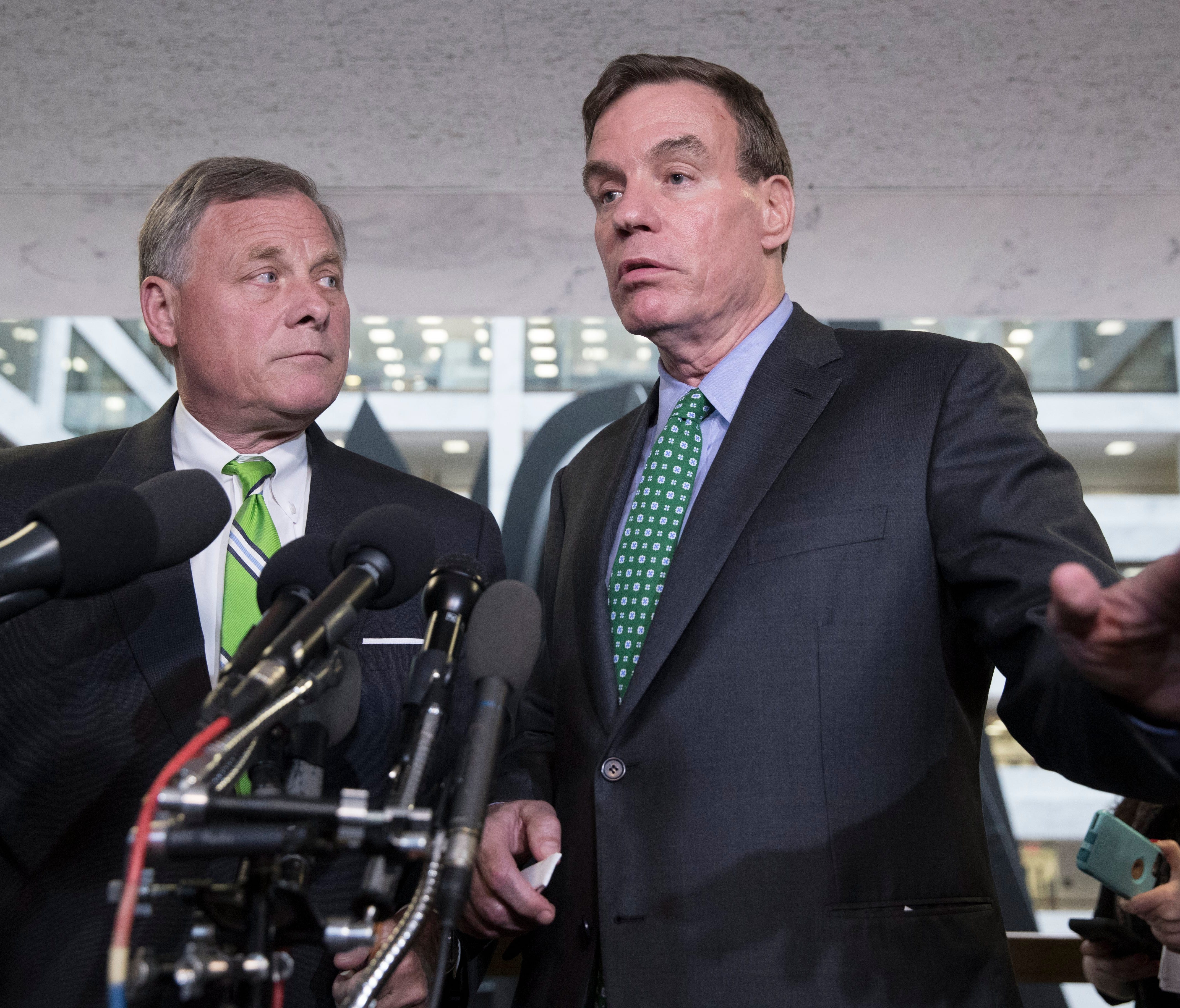 Sen. Mark Warner, the top Democrat on the Senate Intelligence Committee, and Sen. Richard Burr, chairman of the committee, speak to members of the media on Capitol Hill on May 23, 2017.