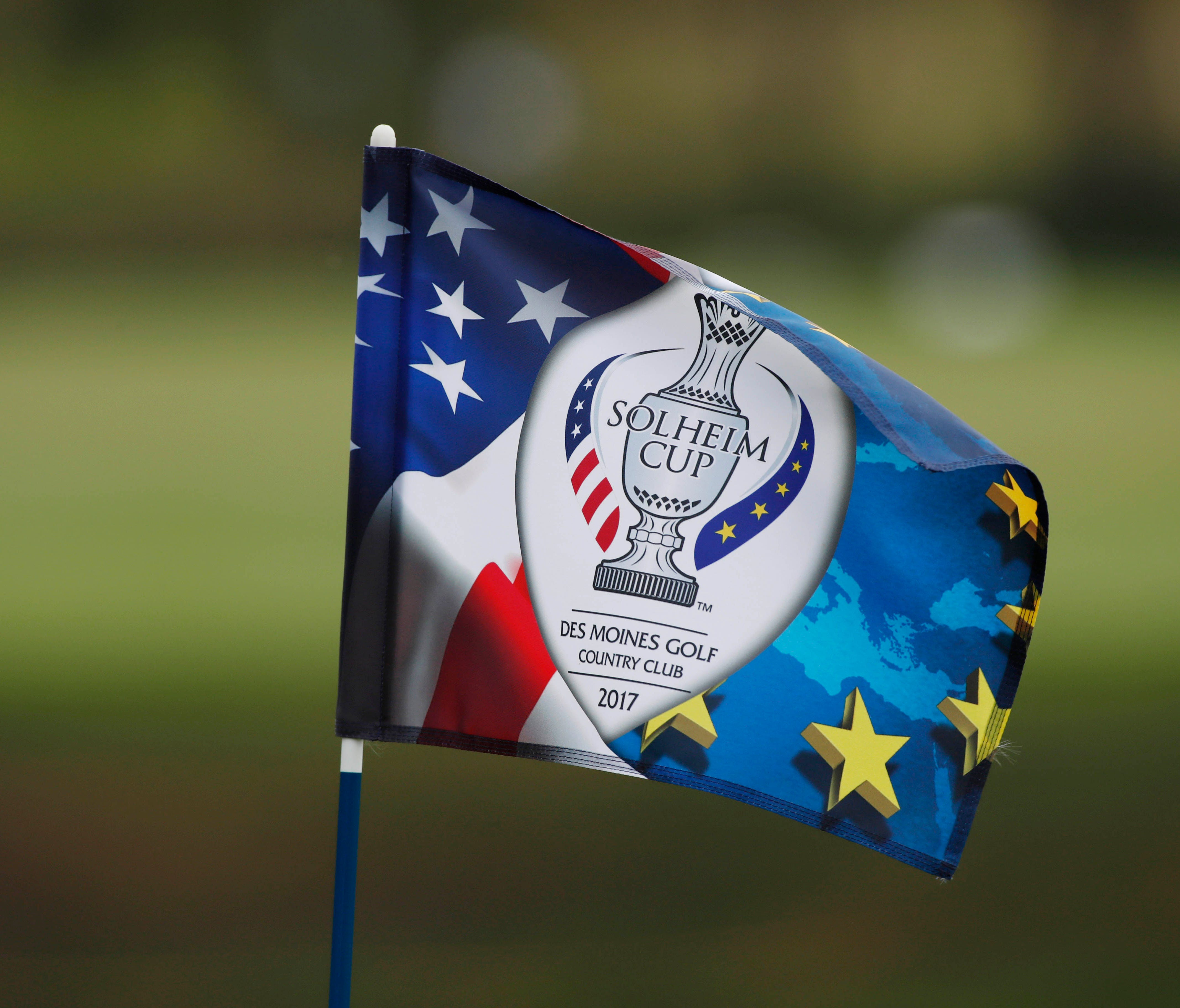 A closeup of the 4th hole pin flag blowing in the wind during the first day of practice during The Solheim Cup.