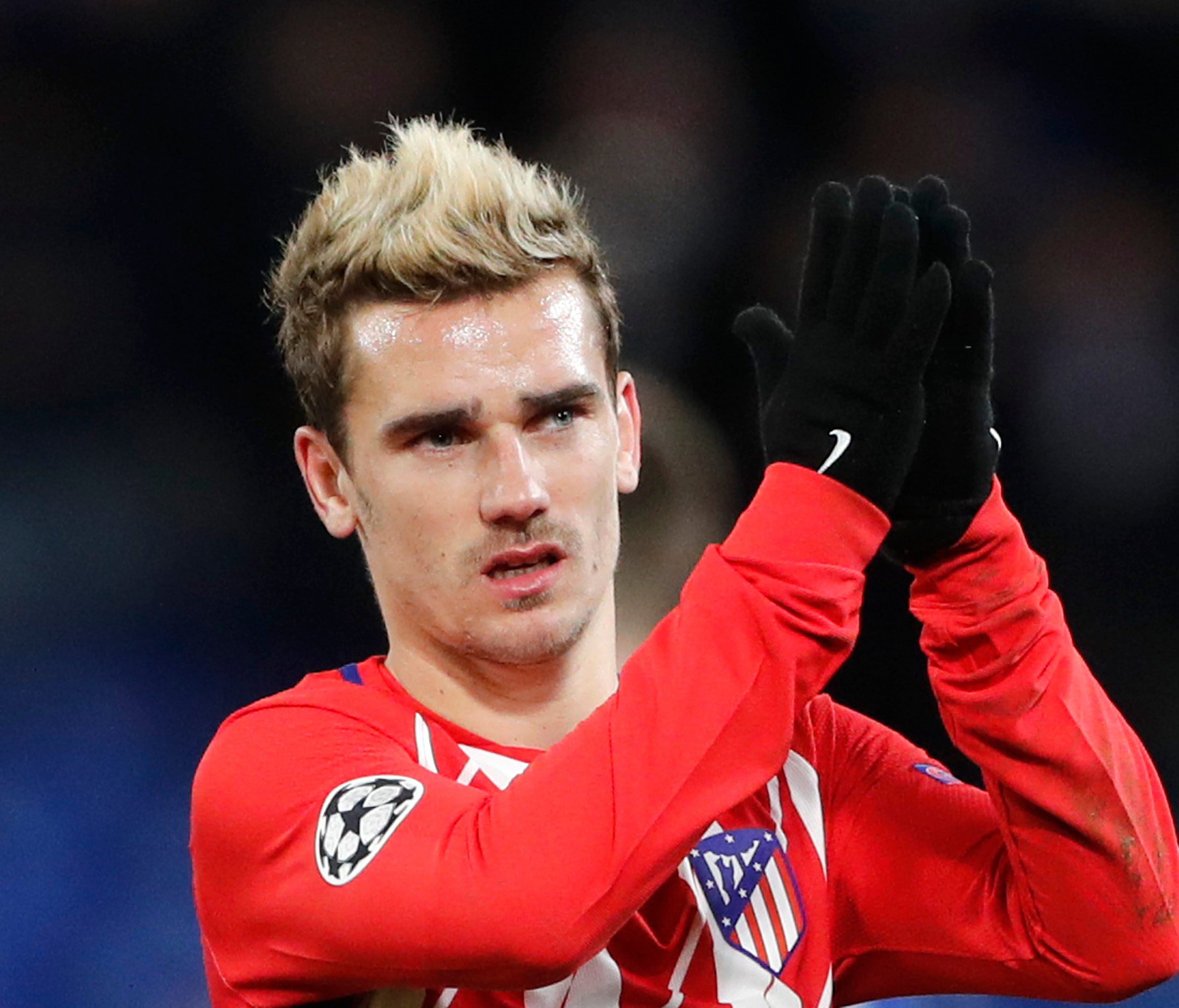 A Dec. 5, 2017 file photo of Atletico's Antoine Griezmann greeting fans after the 1-1 draw in the Champions League Group C soccer match between Chelsea and Atletico Madrid at Stamford Bridge stadium in London.  Griezmann has apologized after posting 