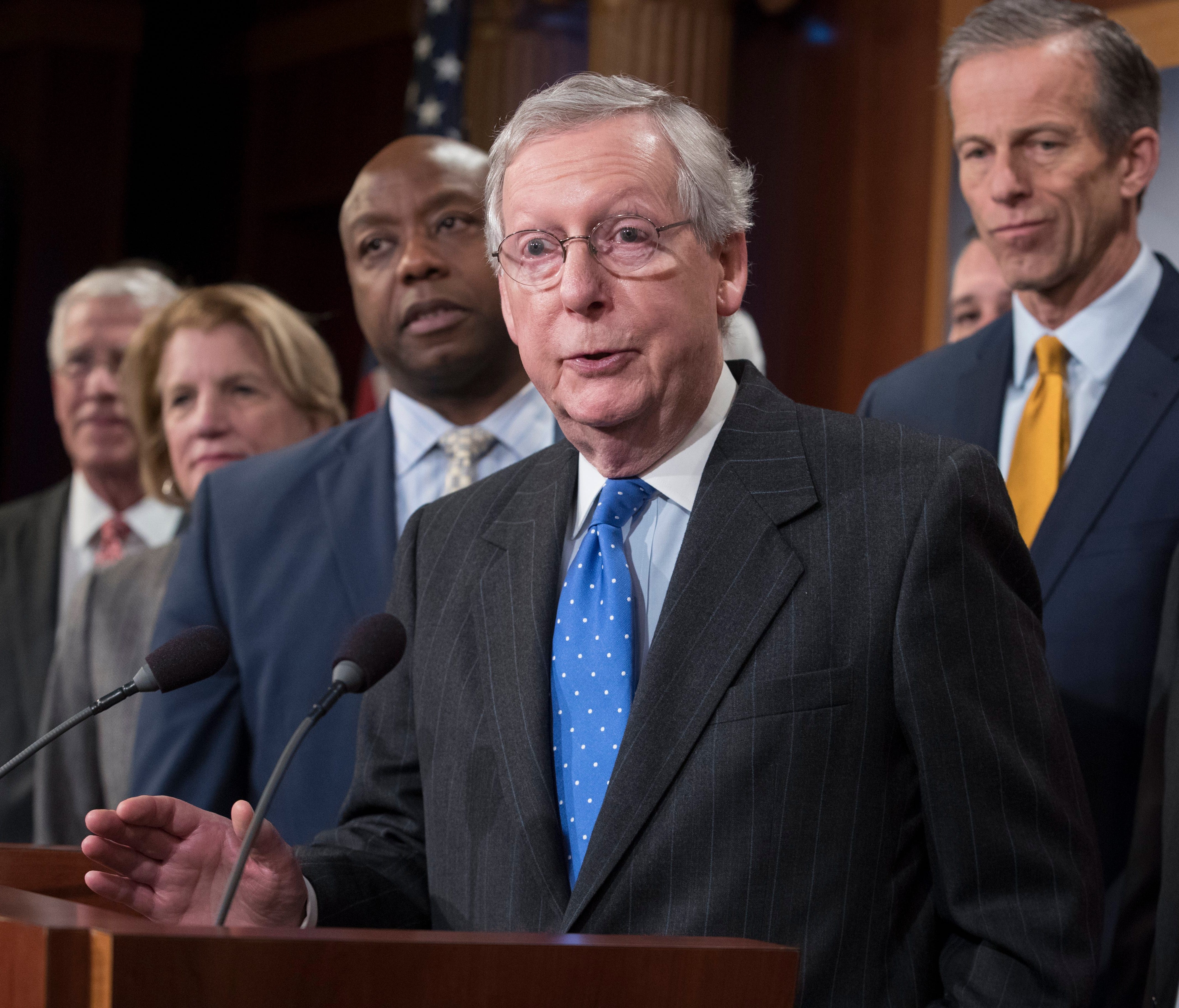 Senate Majority Leader Republican Mitch McConnell (C) is pictured speaking beside other Senate Republicans during a news conference after the Senate passed the Republican tax plan early Wednesday.