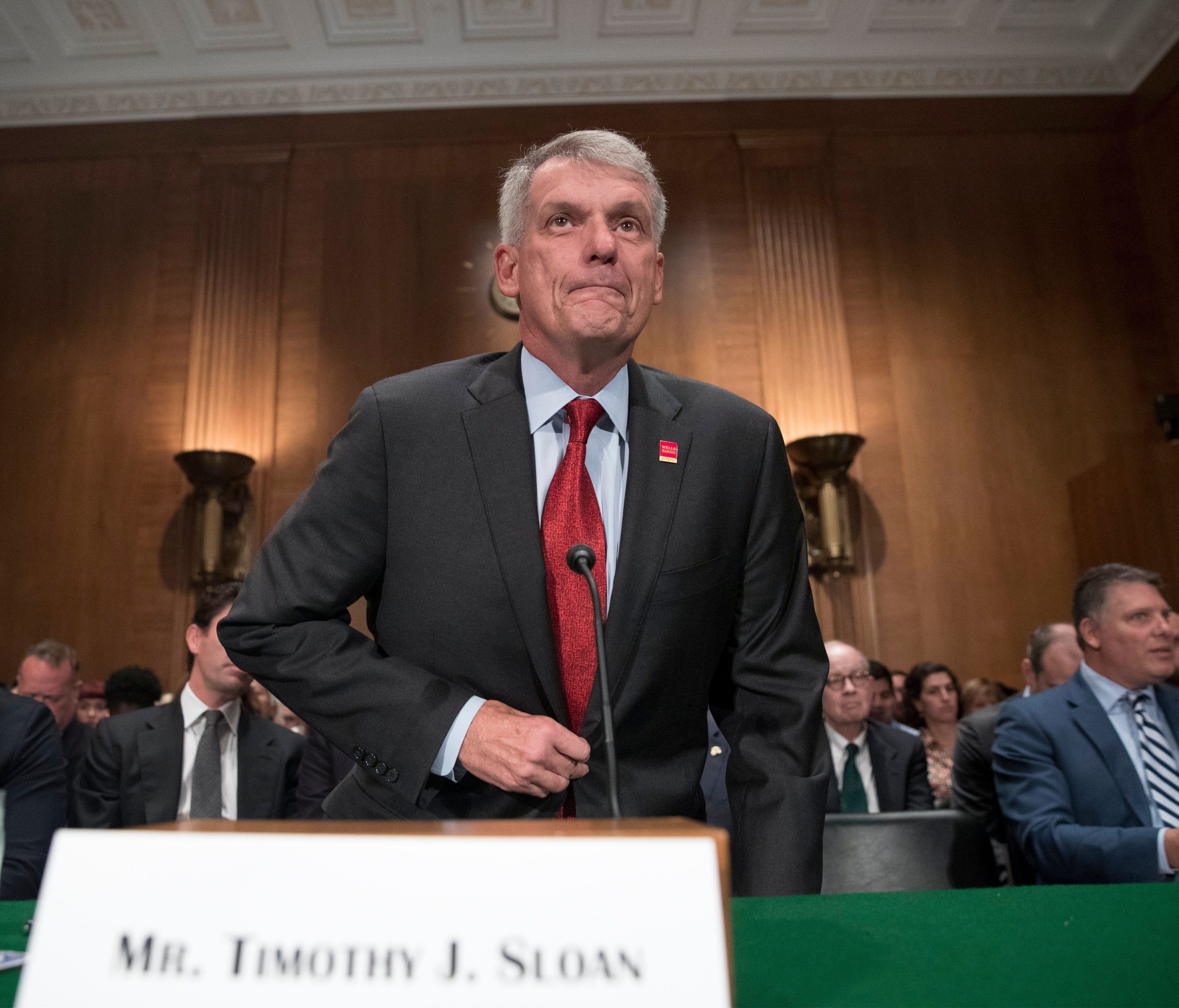 File photo taken in 2017 shows Wells Fargo CEO Timothy Sloan arriving to testify at a hearing by the Senate Banking, Housing and Urban Affairs Committee in Washington, D.C.