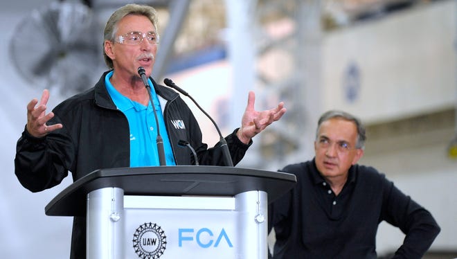 Former United Auto Workers Vice President Norwood Jewell, left, with the late Fiat Chrysler CEO Sergio Marchionne, is among "lots of individuals and entities" under criminal investigation by the federal government, a prosecutor said Friday.