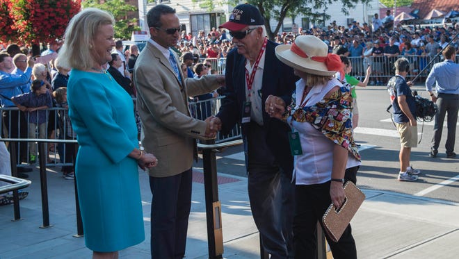 Hall of Famer Gaylord Perry and his wife are greeted by Jane Forbes Clark, chairwoman of the Hall of Fame, and Hall of Fame President Jeff Idelson in Cooperstown during the parade of legends in July of 2016.