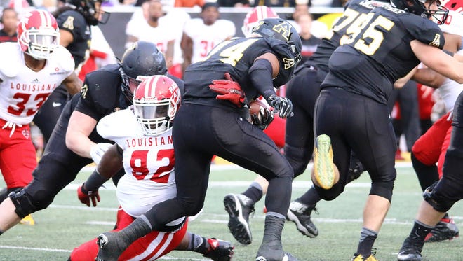 UL defensive lineman Taboris Lee (92), shown here making a tackle in the Appalachian State backfield, was one of the bright spots for the Cajuns in Saturday’s 28-7 road loss to Appalachian State.