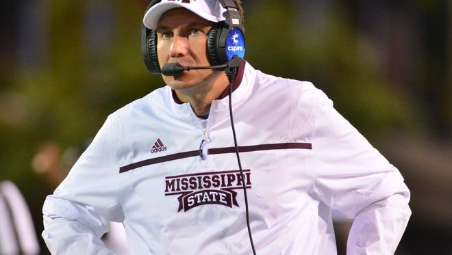 Sep 12, 2015; Starkville, MS, USA; Mississippi State Bulldogs head coach Dan Mullen talks into a headset during the 2nd quarter of the game against the LSU Tigers at Davis Wade Stadium. Mandatory Credit: Matt Bush-USA TODAY Sports