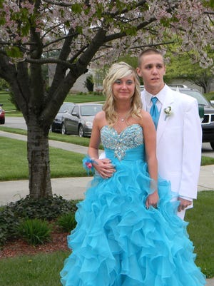 Rachel Beach and Connor McNay pose for photos before the Ryle High School prom in 2013