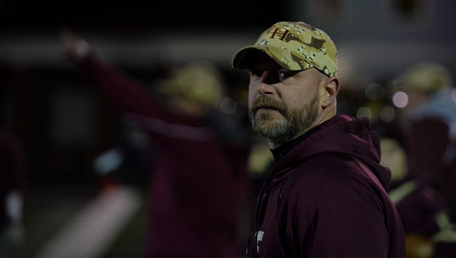 Licking Heights coach Darren Waters watches the clock during a Division II regional semifinal loss to Worthington Kilbourne. He led the Hornets to their third 10-win season since 2007.