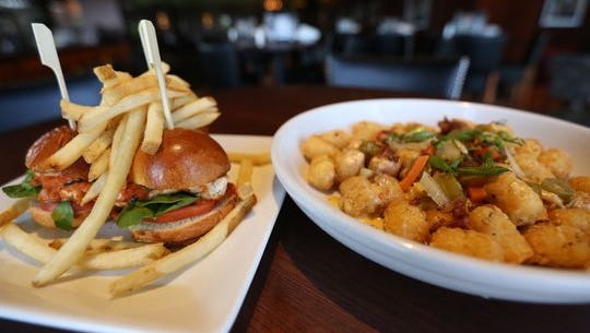 Chicken parm sliders and loaded tater tots at a Bar Louie in West Des Moines. Bar Louie is one of the new dining options at the revamped Foothills Mall.