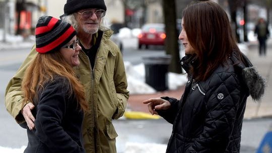 Laura Ruhling, left. chats with friend Barbara Leonard, right, and Harold Turner, who used to be homeless until he got an apartment in York through local agencies.