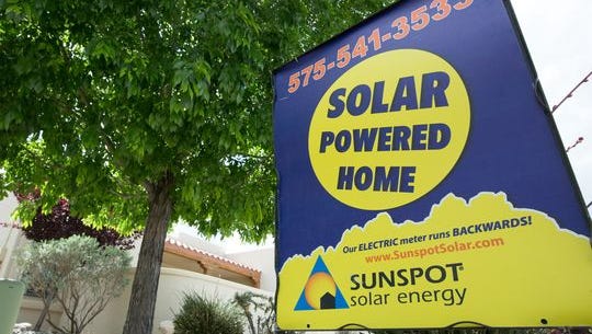 A Sunspot Solar Energy sign is posted in front of a house on the corner of East Springs Road and Featherstone Drive on Monday April 18, 2016.