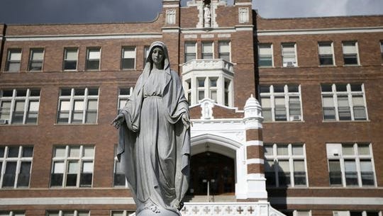 The front of Mother of Mercy High School in the Westwood neighborhood of Cincinnati on Thursday, March 2, 2017. Mother of Mercy and McAuley catholic high schools announced Thursday that they will merge into one new Mercy McAuley Catholic High School at McAuley's current College Hill campus beginning in the 2018-19 school year.