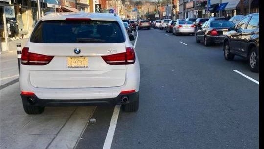 A photograph posted on the Facebook group, Millburn 'Complete' Insanity, shows an example of poor parking on a new spot in Millburn's downtown.