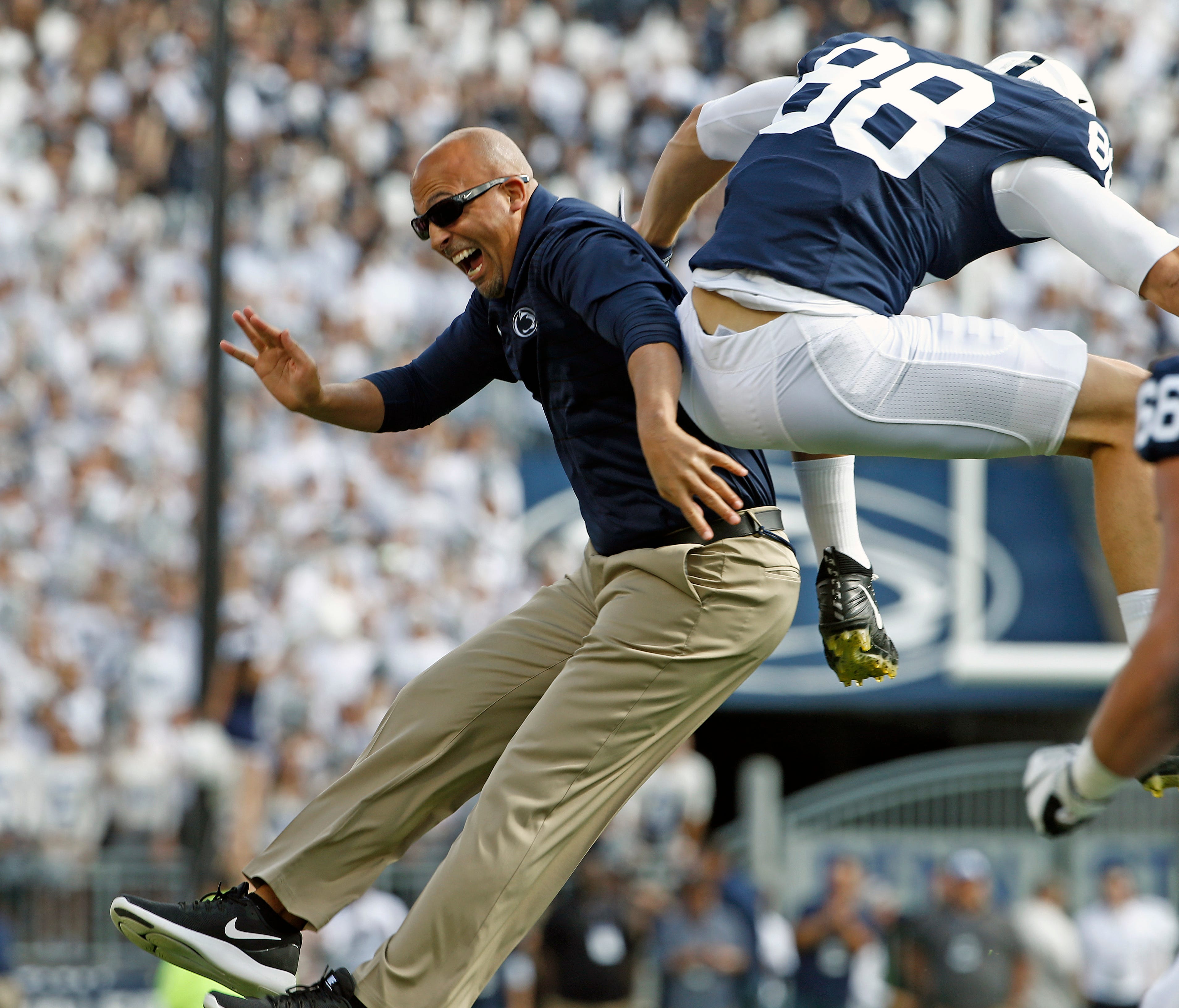 Penn State head coach James Franklin, left, celebrates with tight end Mike Gesicki.