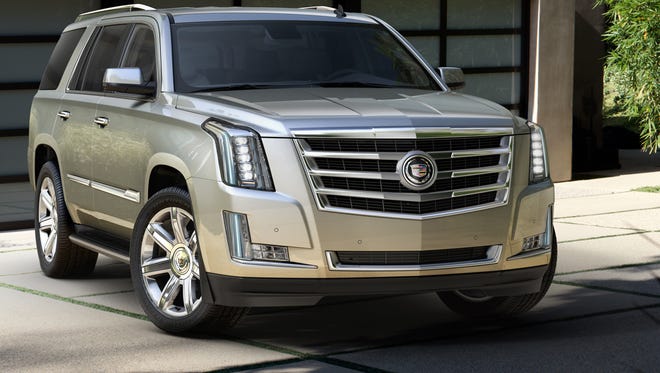 Sales of GM's redesigned, 2015 Cadillac Escalade nearly doubled in July, part of a surge in SUV sales that power jumps at all Detroit automakers.