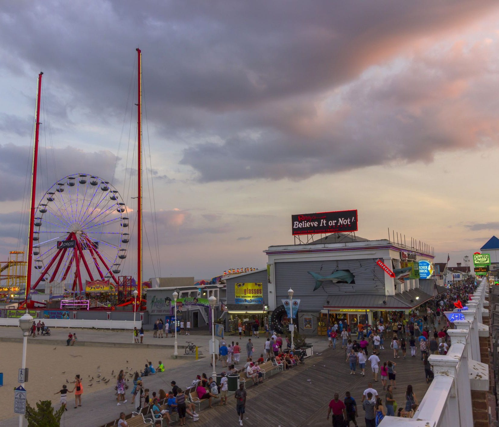 The long wooden boardwalk is Ocean City's iconic gathering place, lined with vintage arcades for games and rides, souvenir shops, and all the deliciously fried food you can eat.