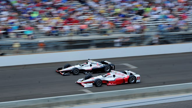 May 24, 2015; Indianapolis, IN, USA; IndyCar Series driver Will Power (1) races Simon Pagenaud (22) during the 2015 Indianapolis 500 at Indianapolis Motor Speedway. Mandatory Credit: Thomas J. Russo-USA TODAY Sports