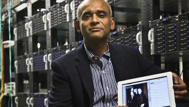 Chet Kanojia, founder and CEO of Aereo, with a tablet displaying his company's technology, in New York in 2012.