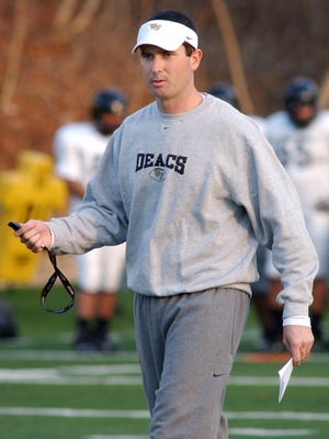 Tommy Elrod walks on the field while coaching at Wake Forest on Dec. 9, 2006.