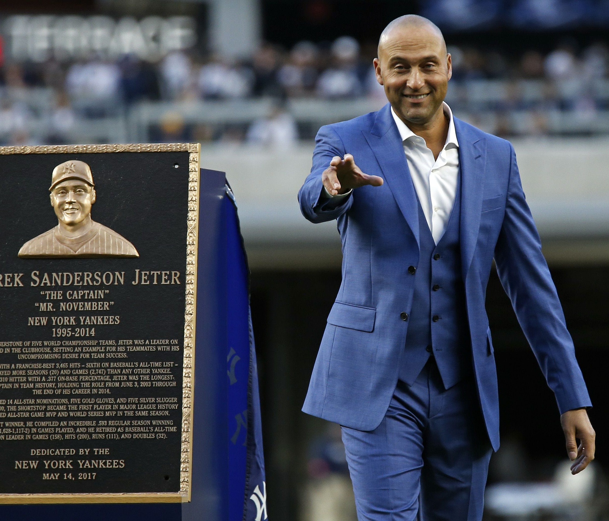 Derek Jeter gestures to his Yankee family during his jersey retirement ceremony Sunday.