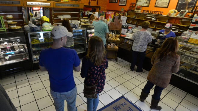 Customers shop for goodies at  J's Pastry in East Hill. Portabello Market co-owner Ryan Thomas announced on Facebook Thursday that he and his wife/partner had purchased the building and will move their restaurant there, leaving the bakery's future in doubt.