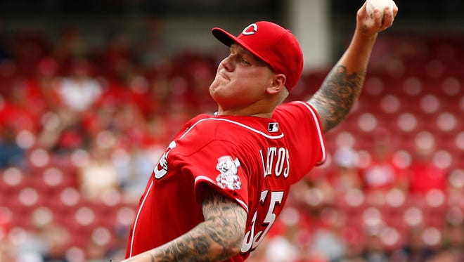 Cincinnati Reds starting pitcher Mat Latos (55) throws against the Washington Nationals in the second inning at Great American Ball Park.