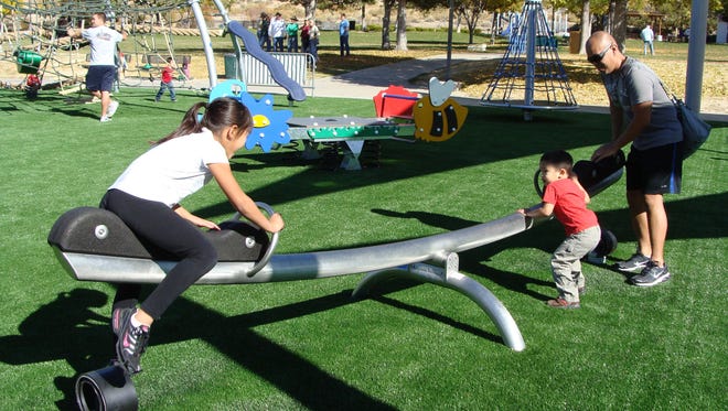 Kids play at accessible Pah-Rah Park in Sparks.