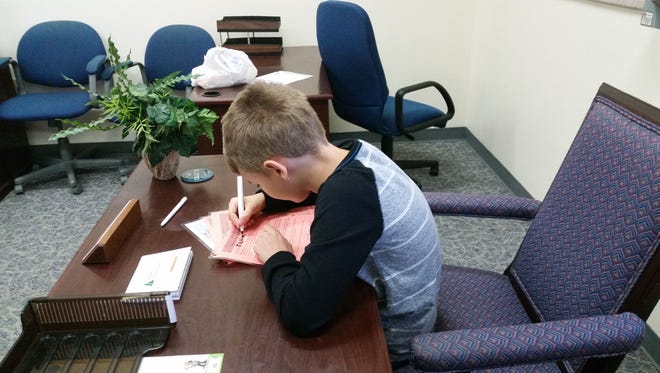 Jackson Heller works on his opening speech in his office at BizTown.