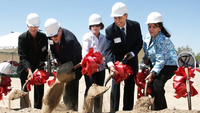 Investment Builders CEO Ike Monty, second from right, takes part in a 2012 ground-breaking ceremony for a West Side apartment complex.
