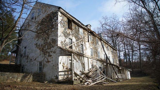 Walker's Bank, a collection of attached residences built on the banks of the Brandywine River c: 1814, is slated for demolition. Residents and history buffs are asking county regulators to delay their approval of a demolition permit in hopes the building can be preserved.