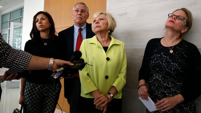 The family of shooting shooting victim Kristine Kirk, from right, sister Tammy Heman, parents Marti and Wayne Kohnke, and an unnamed family member, talk with members of the media a following the sentencing of Kirk's husband, Richard Kirk, in the April 2014 fatal shooting at the Kirks' home. Richard Kirk claimed that eating pot candy caused him to shoot his wife, and he was sentenced to 30 years prison April 7, 2017, in Denver.