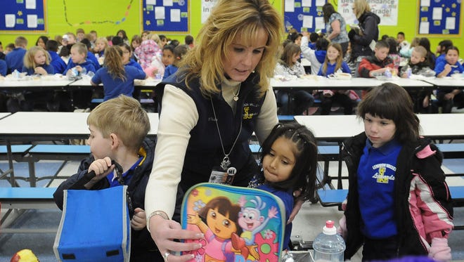 Former Lemmon Valley Elementary School Principal Kara White helps kindergartners in 2011.