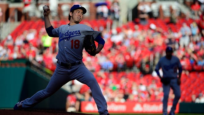 Los Angeles Dodgers starting pitcher Kenta Maeda pitches against the St. Louis Cardinals at Busch Stadium.