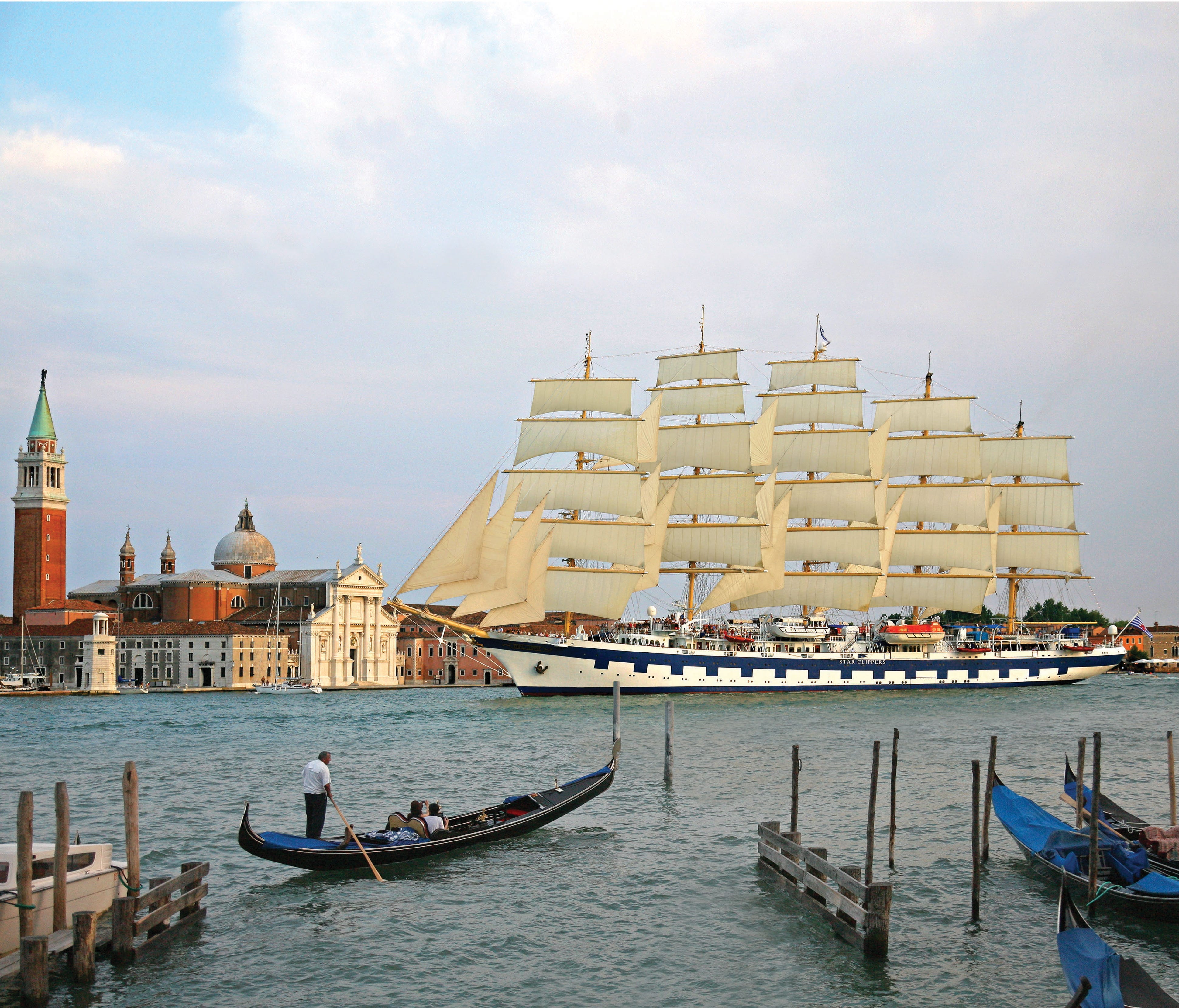 The Star Clippers fleet includes the five-masted Royal Clipper, a 439-foot, 227-passenger ship with three pools, a four-deck atrium and 56,000-square-feet of sails, pictured here in Venice.