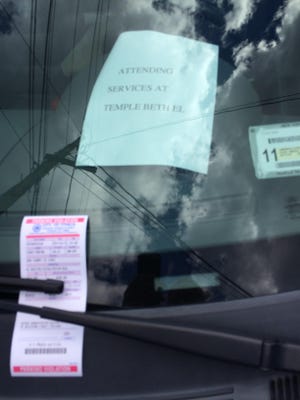 A car parked outside of Temple Beth El got ticketed Monday while the driver was attending Rosh Hashana services.