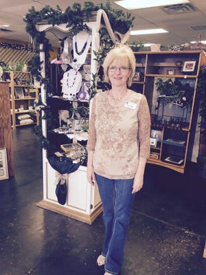 Lana Rae, executive director of Christian Women’s Job Corps, helps out at the group’s thrift store, Ozarks Mountaintop Cottage.