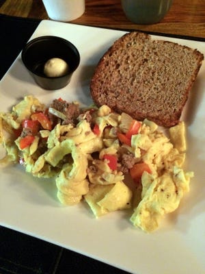 The eggs scrambled at Movara Fitness Resort consists of a slice of toast and scrambled eggs with peppers, onions and turkey sausage.